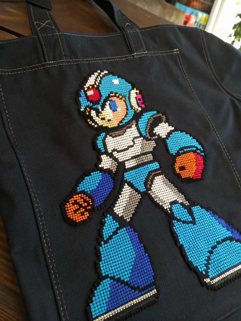 A detailed close-up of a piece of Mega Man X pixel art, highlighting the intricate details and vibrant colors.